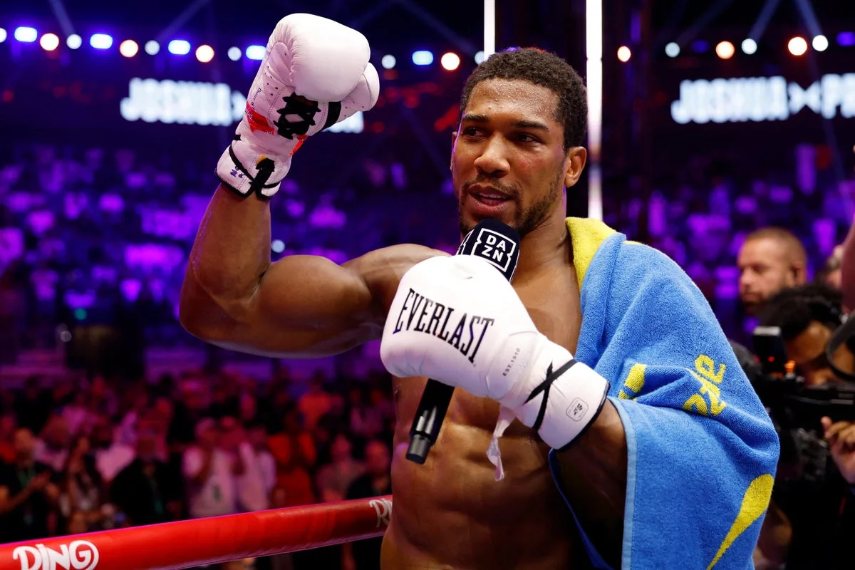 Joshua Survives Knockdowns to Secure Fight with Fury