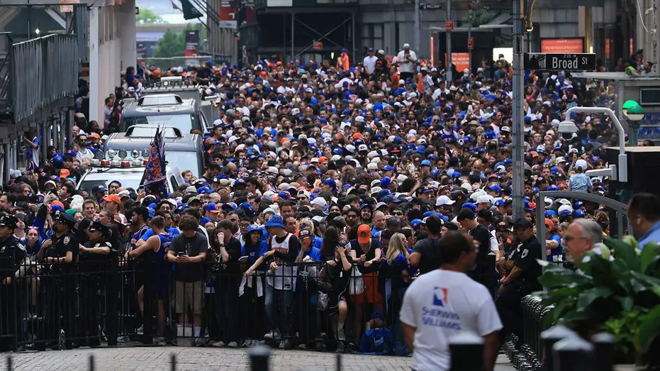JPMorgan Chase Executive Fired After Identified in Video Dumping Trash During Knicks Parade