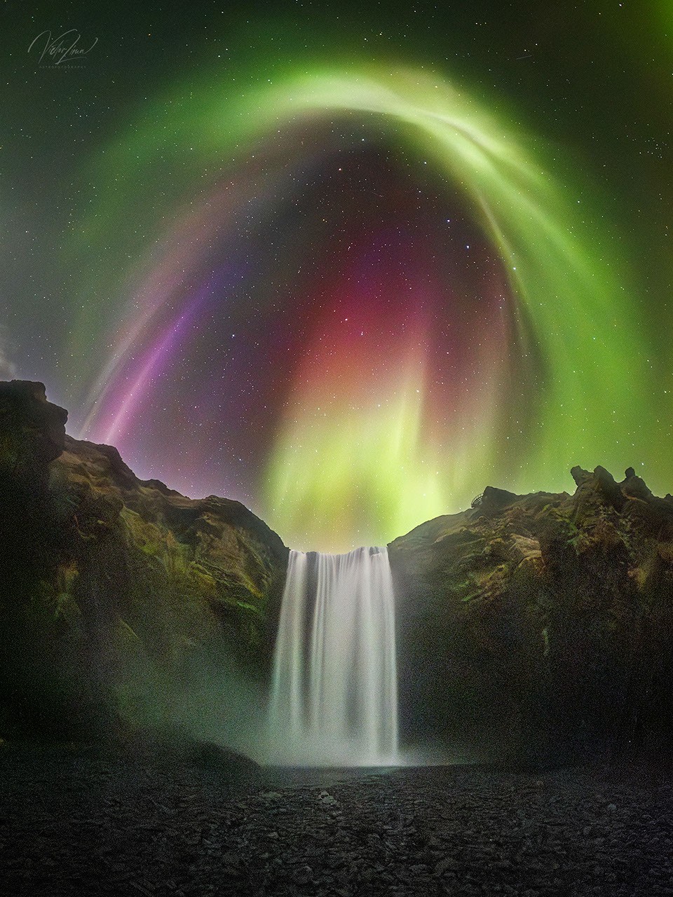 NASA Features Colorful Aurora Over Icelandic Waterfall