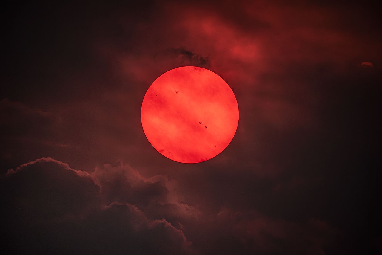 NASA's APOD Features Red Sun Through Wildfire Smoke