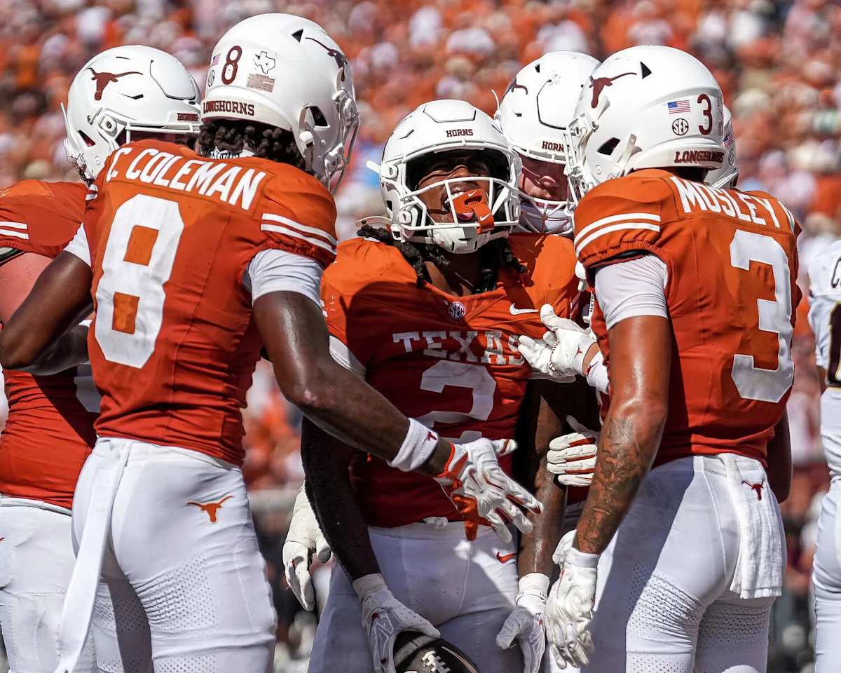 Texas Defeats Texas State 59-7, Manning Leads the Way