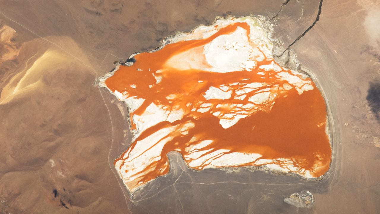 Astronaut Photo Captures Orange Water 'Bleeding' Across Bolivian Salt Lake