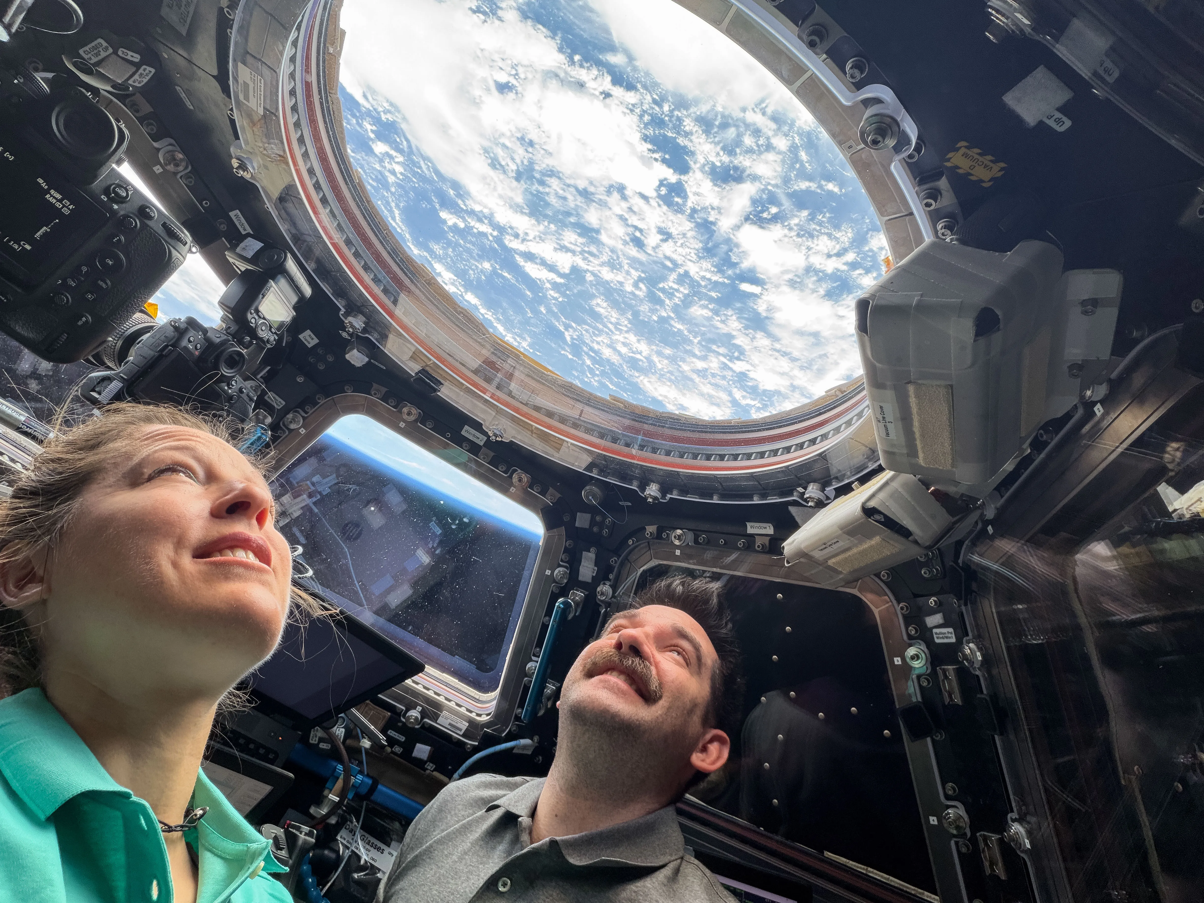 Astronauts Monitor SpaceX Dragon Docking at International Space Station